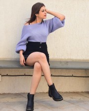 Classy Shraddha Das in a Knitted Lavender Top and Black Mini Skirt Pictures 02