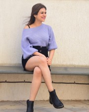 Classy Shraddha Das in a Knitted Lavender Top and Black Mini Skirt Pictures 04