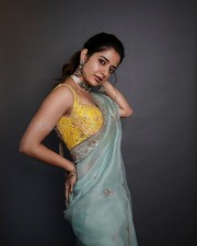 Dazzling Ashika Ranganath in a Yellow Sleeveless Blouse and Embroidered Saree Photos 03