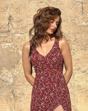 Delightful Ashika Ranganath in a Sleeveless V Neck Maroon Floral Dress Photos 01 Delightful Ashika Ranganath in a Sleeveless V Neck Maroon Floral Dress Photos 01