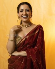 Elegant Actress Ashika Ranganath in a Maroon Silk Saree with Gold Border Photos 02