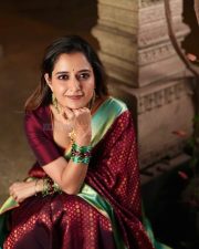 Elegant Actress Ashika Ranganath in a maroon saree Photos 01