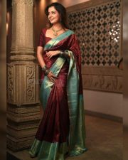 Elegant Actress Ashika Ranganath in a maroon saree Photos 02