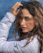 Enigmatic Actress Ashika Ranganath in a White Puffer Jacket Photos 03