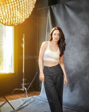 Glam Sandeepa Dhar in a White Tank Top and Trousers Photos 03