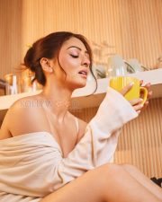 Luminous Actress Sandeepa Dhar in a White Off Shoulder Oversized Sweater Photos 01