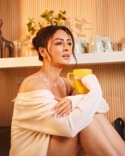 Luminous Actress Sandeepa Dhar in a White Off Shoulder Oversized Sweater Photos 03