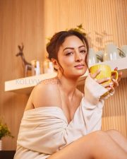Luminous Actress Sandeepa Dhar in a White Off Shoulder Oversized Sweater Photos 04