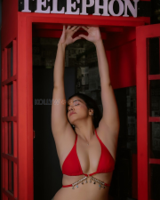 Provocative Archana Singh Rajput Cleavage in a Red Bikini Top Low rise Denim Jeans Photos 06