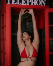 Provocative Archana Singh Rajput Cleavage in a Red Bikini Top Low rise Denim Jeans Photos 06