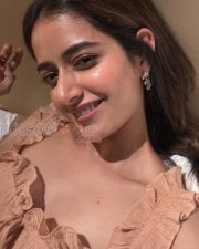 Radiant Actress Ashika Ranganath in a Peach Ruffled Crop Top Photos 03