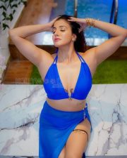 Seductive Archana Singh Rajput Cleavage in a Blue halter bikini and slit skirt Photos 08