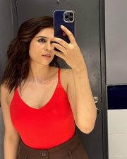 Sexy Telugu Beauty Shraddha Das Selfie in a Red Sleeveless Top and Brown High Waisted Pants Photos 01