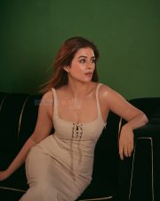 Striking Actress Shraddha Das in a Cream Lace Up Bodycon Dress Photos 06