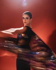 Stunning Sanya Malhotra in a Purple Sleeveless Blouse with a Black Designer Saree Photos 04