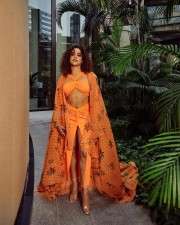 Stylish Sanya Malhotra in a Saffron Beach Wear Photos 02