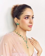 Stylish Sanya Malhotra in a Soft Pink Lehenga with a Strapless Blouse and Sheer Dupatta Photos 02