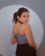 Stylish Shraddha Das in a Beige Sleeveless Corset Top with Black Pant Pictures 03