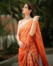 Traditional Beauty Ashika Ranganath in an Orange Lehenga Photos 01