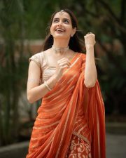 Traditional Beauty Ashika Ranganath in an Orange Lehenga Photos 02