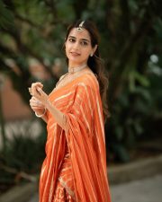 Traditional Beauty Ashika Ranganath in an Orange Lehenga Photos 03
