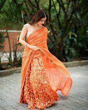 Traditional Beauty Ashika Ranganath in an Orange Lehenga Photos 06