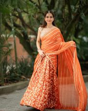 Traditional Beauty Ashika Ranganath in an Orange Lehenga Photos 08