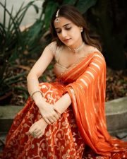 Traditional Beauty Ashika Ranganath in an Orange Lehenga Photos 09