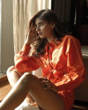 Glamorous Actress Karishma Sharma in a Casual Oversized Orange Shirt Pictures 04