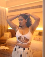 Stunning Karishma Sharma wearing White with Black Dots Cutout Dress in a Bathtub Photos 02