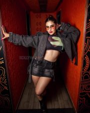 Super Sexy Karishma Sharma in a Black Denim Mini Skirt with a Sheer Crop Top Photos 04