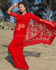 Actress Harshika Poonacha in a Red Saree Stills 01