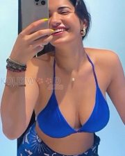 Alluring Ruhani Sharma Cleavage in a Blue halter bikini and floral sarong Photos 02