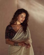 Attractive Ruhani Sharma in a Cream Saree and Printed Blouse Photos 03