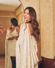 Attractive Sonam Bajwa in a White Floral Embroidered Saree with a Matching Deep V Neckline Sleeveless Blouse Pictures 01