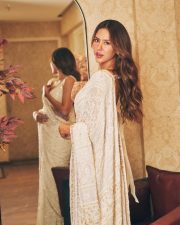 Attractive Sonam Bajwa in a White Floral Embroidered Saree with a Matching Deep V Neckline Sleeveless Blouse Pictures 02