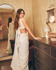 Attractive Sonam Bajwa in a White Floral Embroidered Saree with a Matching Deep V Neckline Sleeveless Blouse Pictures 07