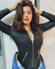 Busty Ketika Sharma in a Black Leather Jacket Paired With Unbuttoned Jeans Photos 02