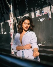 Captivating Ruhani Sharma in a Body Hugging Halter Neck Dress with a Pink Bralette and Torn Jeans Photos 01