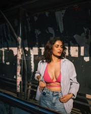 Captivating Ruhani Sharma in a Body Hugging Halter Neck Dress with a Pink Bralette and Torn Jeans Photos 03