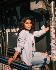 Captivating Ruhani Sharma in a Body Hugging Halter Neck Dress with a Pink Bralette and Torn Jeans Photos 04