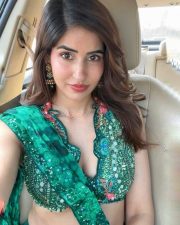 Charismatic Sakshi Malik in a Green Printed Pre Draped Saree with a Halter Neck Blouse Pictures 01