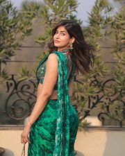 Charismatic Sakshi Malik in a Green Printed Pre Draped Saree with a Halter Neck Blouse Pictures 03