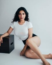 Charming Beauty Ruhani Sharma in a White Knotted T Shirt with a High Waisted Black Mini Shorts Photos 01