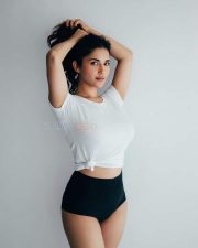 Charming Beauty Ruhani Sharma in a White Knotted T Shirt with a High Waisted Black Mini Shorts Photos 03