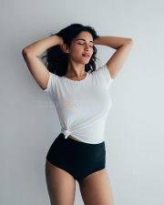 Charming Beauty Ruhani Sharma in a White Knotted T Shirt with a High Waisted Black Mini Shorts Photos 05