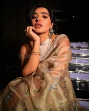 Charming and Elegant Ketika Sharma in a Cream Saree with a Halter Neck Semi Backless Blouse Photos 05