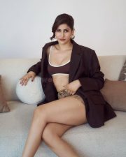 Chic and Bold Sakshi Malik in a Loose Oversized Dark Chocolate Blazer with a Brown Bustier Crop Top with Checked Mini Shorts Photos 04