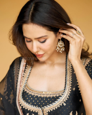 Dazzling Actress Sonam Bajwa in a Black Gold Embroidered Sharara Suit Photos 04