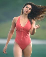 Desirable Actress Sonam Bajwa in a Coral Red One Piece Swimsuit Photos 04